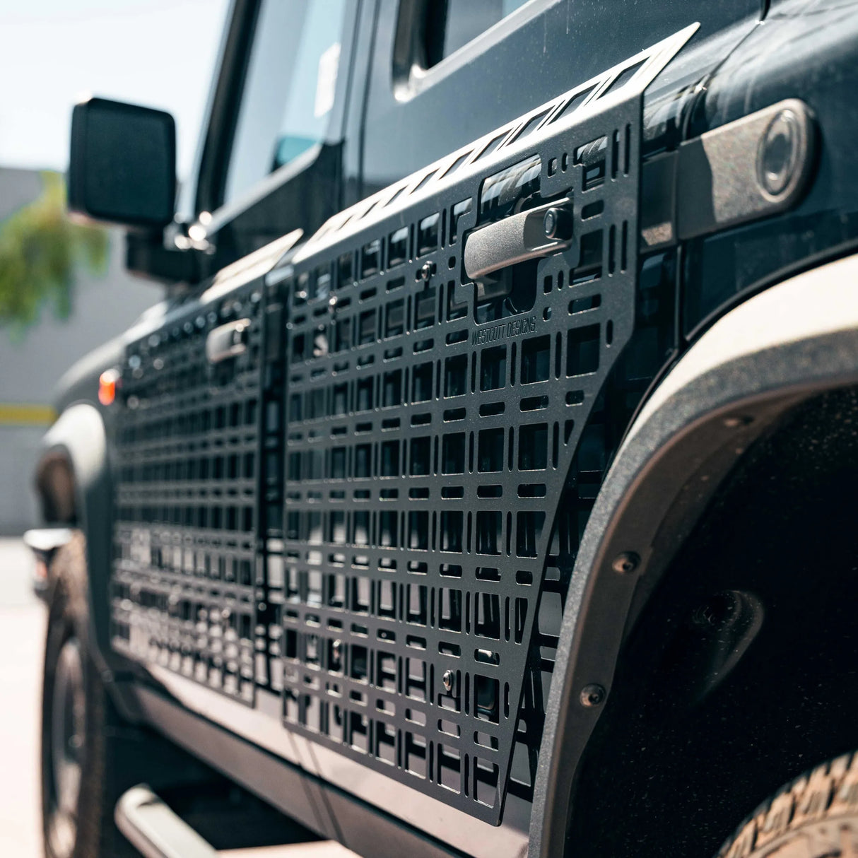 Close-up of a black textured grille on a vehicle