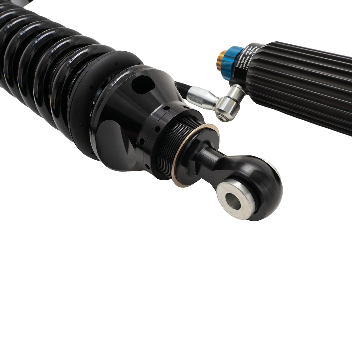 Close-up of a black metal shock absorber on a white background
