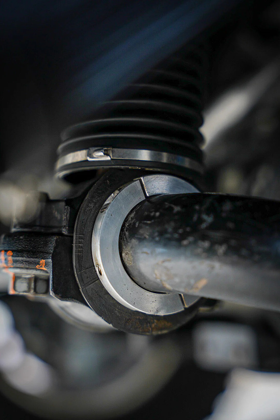 Close-up of a vehicle suspension system with blurred background