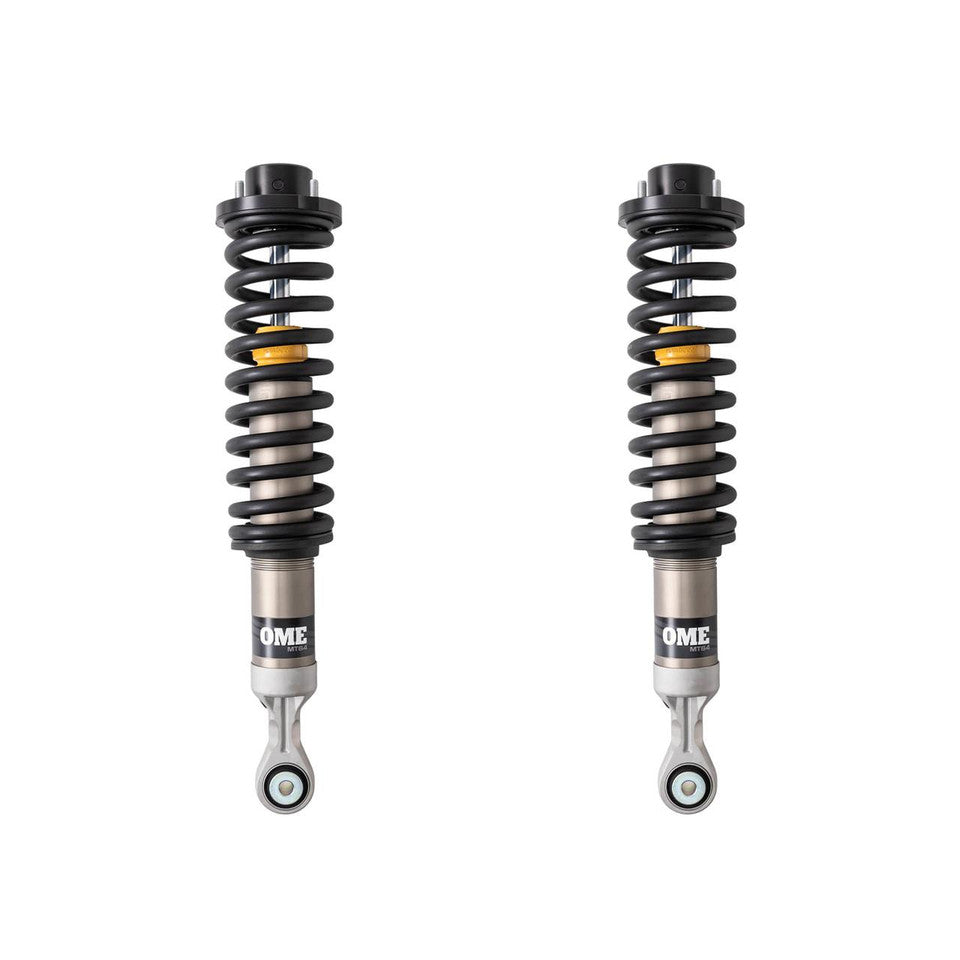 Black, silver and yellow OME coilovers on a white background