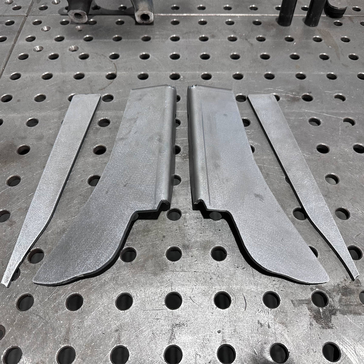 Metal components on a perforated metal surface