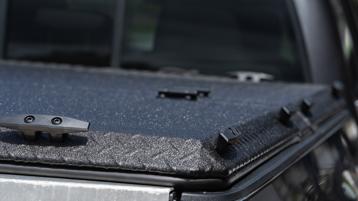 Tie-down cleats on a DiamondBack tonneau cover