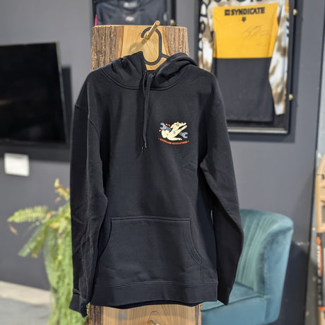 Black hoodie with a logo on a wooden stand in a store setting
