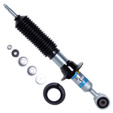 Black and silver shock absorber with spacers on a white background