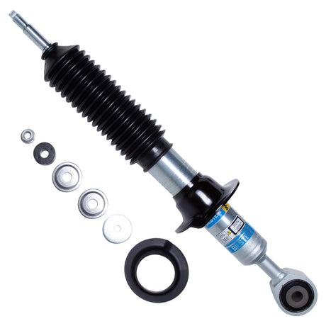 Black and silver shock absorber with spacers on a white background