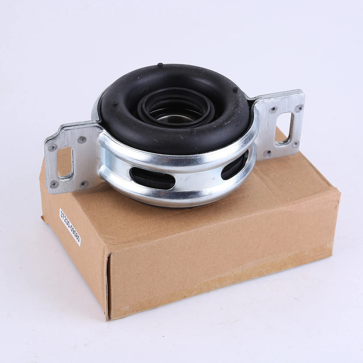 Mechanical component on a cardboard box with a white background