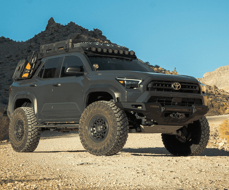 Toyota SUV with off-road equipment in a desert landscape