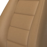 Close-up of a tan leather car seat with stitching details