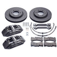 A set of brake kit components including four brake rotors, four brake calipers, brake pads, and mounting hardware.