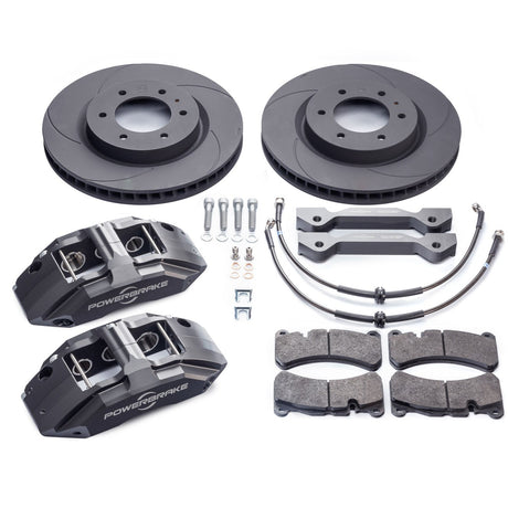 A set of brake kit components including four brake rotors, four brake calipers, brake pads, and mounting hardware.