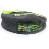 Black and green bag with mesh side, containing green items on a white background