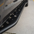 Close-up of a black slider on a concrete surface