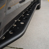 Close-up of a black slider on a concrete surface