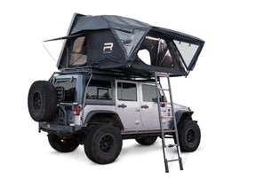 Roof top tent attached to a Jeep on a white background