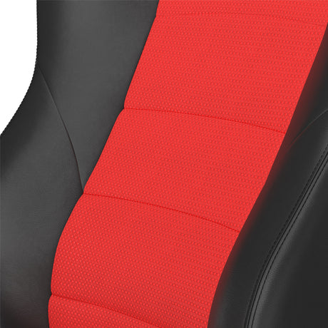 Close-up of a red car seat cover with black leather sides on a white background