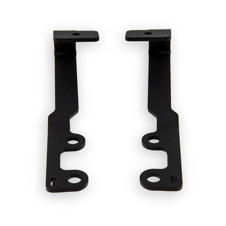 Two black metal brackets on a white background