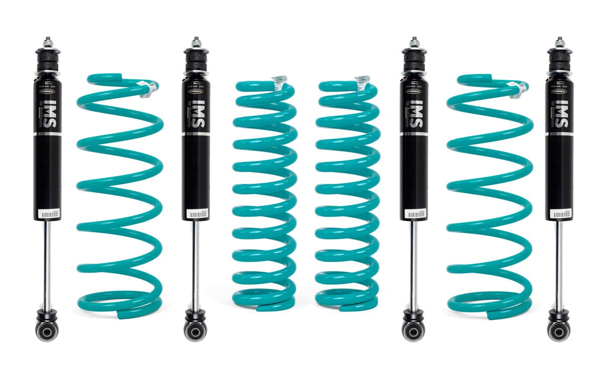 Set of four shock absorbers with coiled springs on a white background