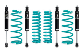 Set of four shock absorbers with coiled springs on a white background