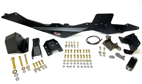A photograph of a JD Fabrication rear spring under kit for 2005-2023 Toyota Tacoma, displaying various metal components and hardware for the kit.