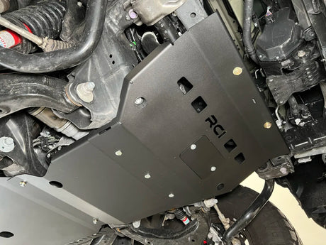 Metal skid plate on a vehicle with 'RCI' branding