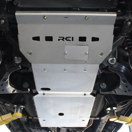 Metal component with 'RCI' branding on a mechanical background