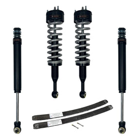 Set of car shock absorbers and springs on a white background