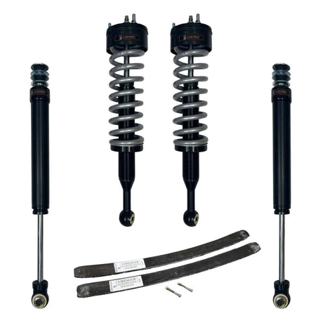 Set of car shock absorbers and springs on a white background