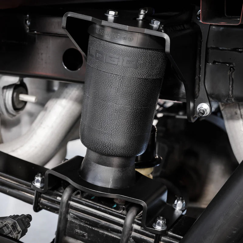 Close-up of a black air suspension system on a vehicle