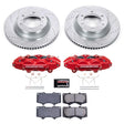 Brake disc rotors, red calipers, and brake pads on a white background