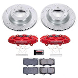 Brake disc rotors, red calipers, and brake pads on a white background