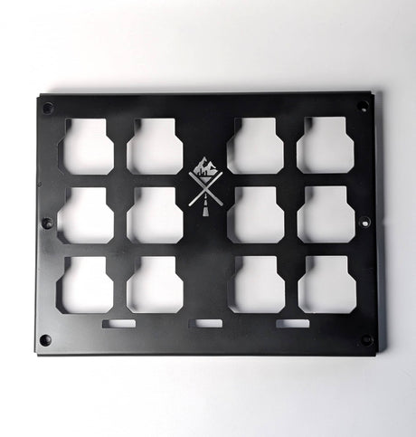 Black metal panel with cut-out shapes on a white background