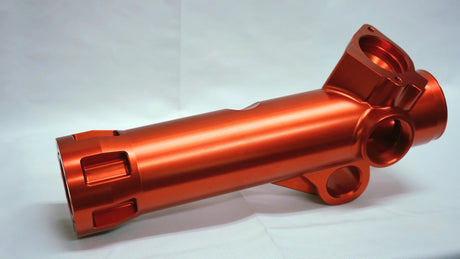 Orange metal shaft on a white background