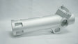 Metallic cylindrical component on a gray background