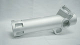 Metallic cylindrical component on a gray background