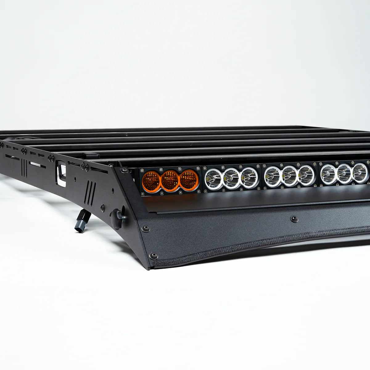 LED light bar mounted to roof rack with multiple lights on a white background