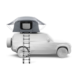 Car with a rooftop tent and ladder on a white background