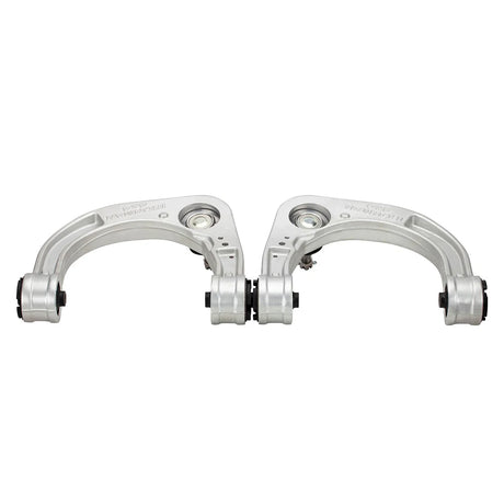 Two metal suspension control arms on a white background