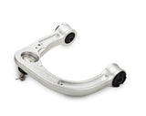 Metal vehicle suspension control arm on a white background