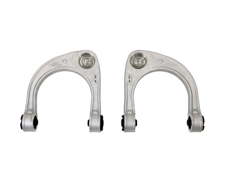 Two metallic control arms on a white background