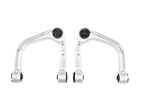 Two metal suspension control arms on a white background