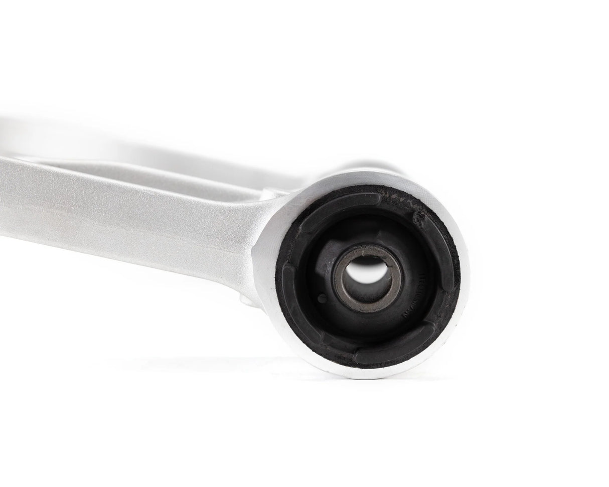 Close-up of a mechanical component with a white shaft and black rubber bushing on a white background