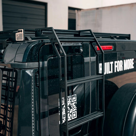 Black SUV and ladder with Westcott Designs branding.