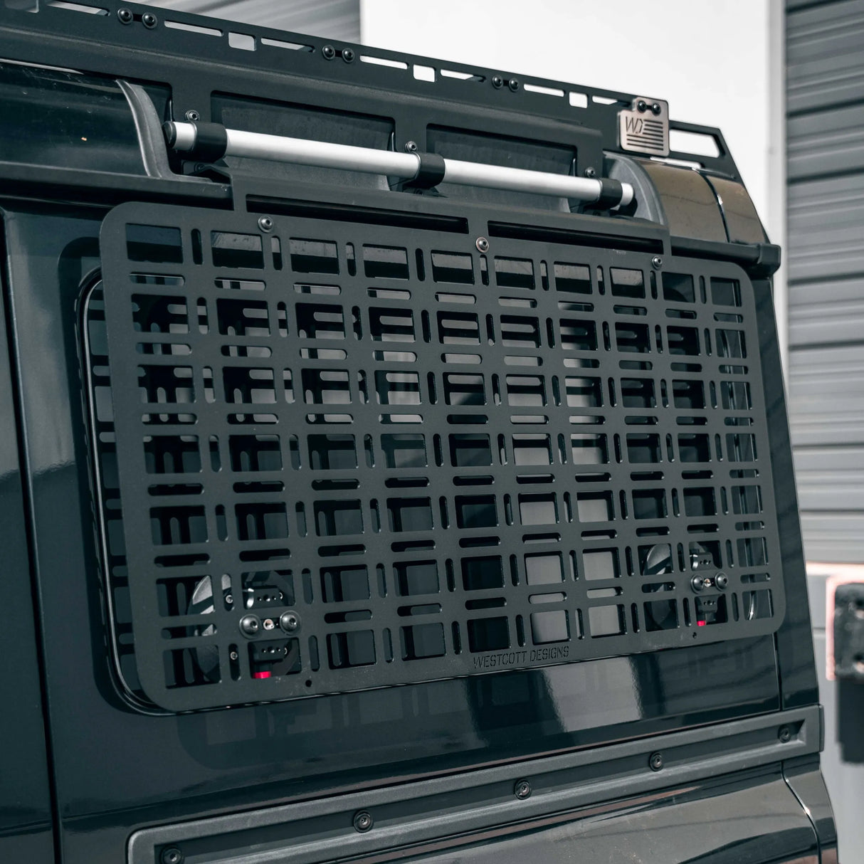 Black vehicle cargo basket on a car with a blurred background