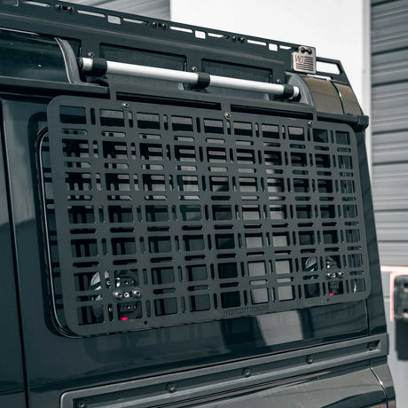 Black vehicle cargo basket on a car with a blurred background