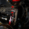 Close-up of a car suspension system with 'APEX' branding.