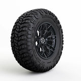 Black tire with tread pattern on a white background