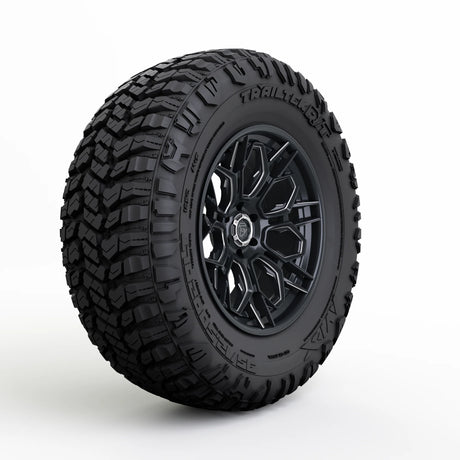 Black tire with tread pattern on a white background