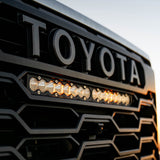 Close-up of a Toyota grille with LED lights
