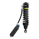 Black shock absorber with visible branding on a white background