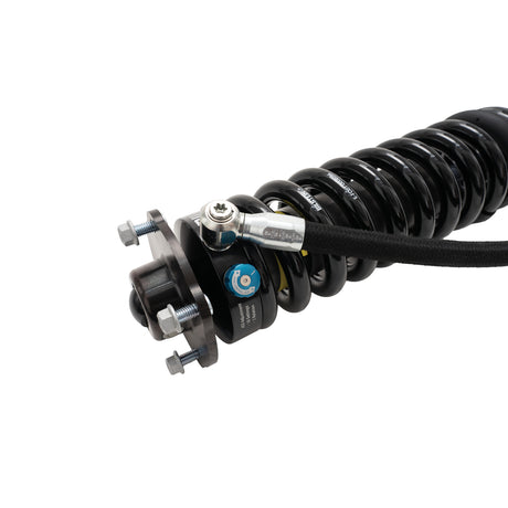 Shock absorber with visible branding on a white background